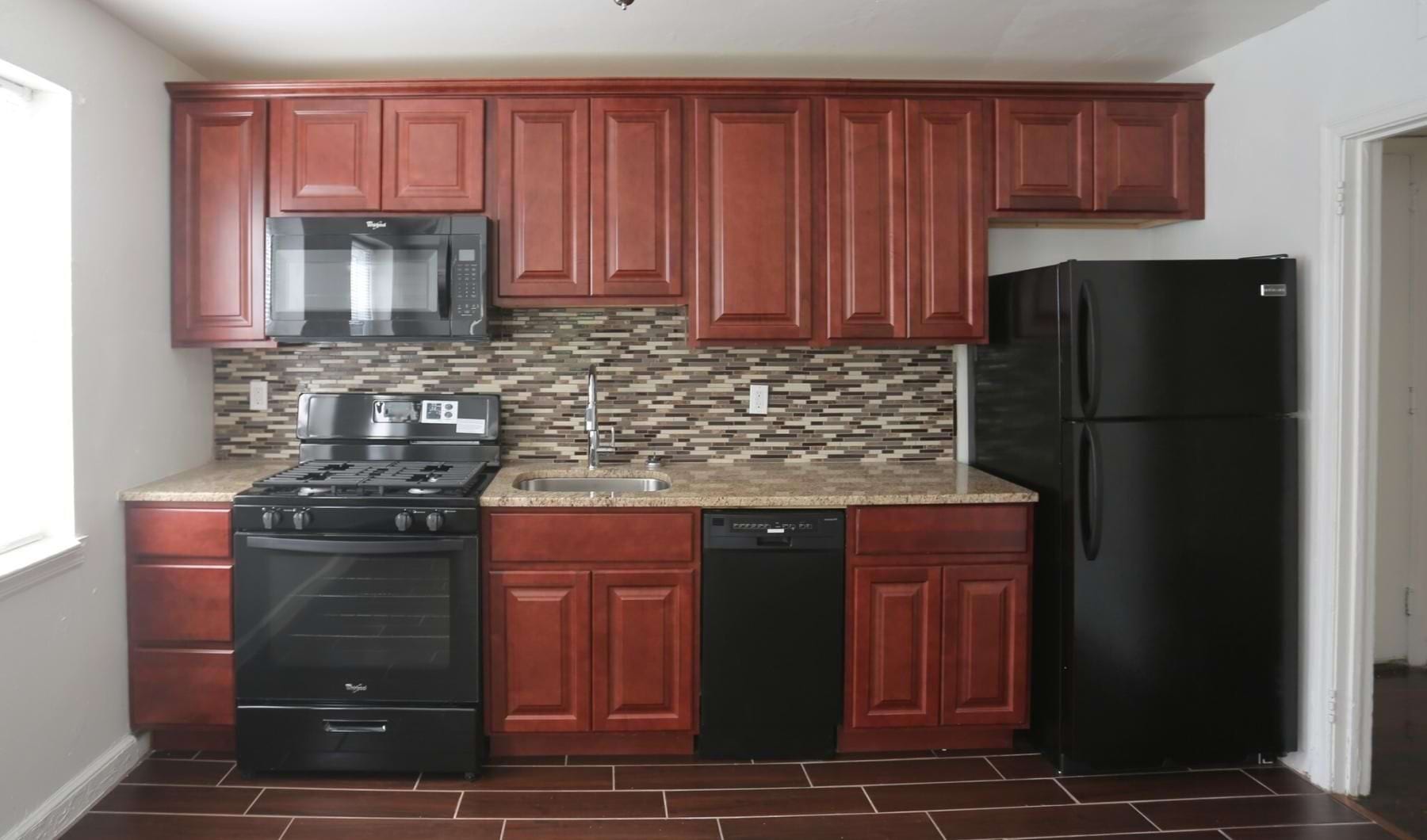 A perfect fit for the whole family a kitchen with wooden cabinets